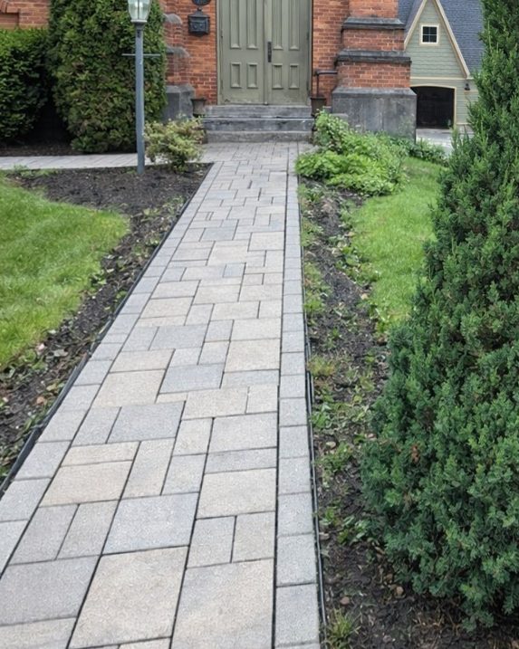 The same paver walkway after pressure washing, light and even