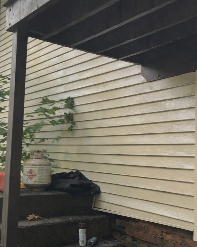The same siding under the deck after washing, clean and even